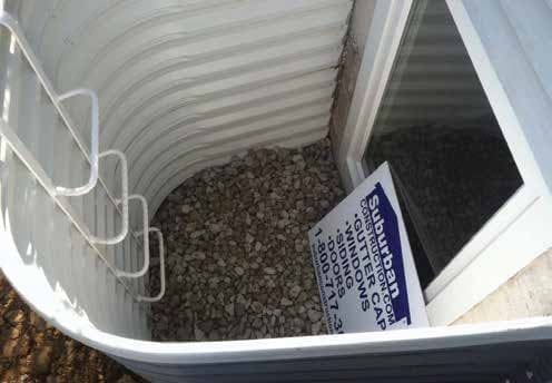 Egress window installation in basement providing emergency exit and natural light