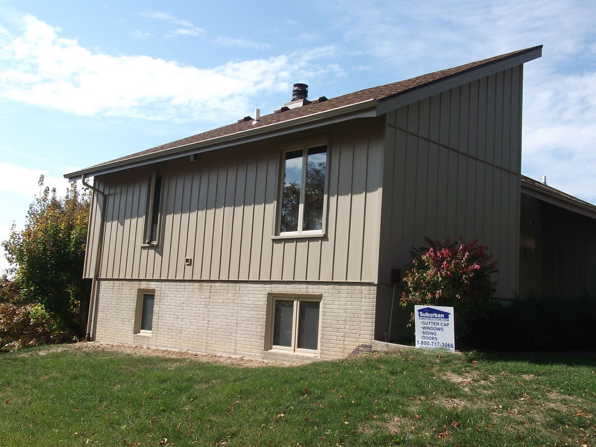 Board and batten steel siding installed on a Quad Cities home